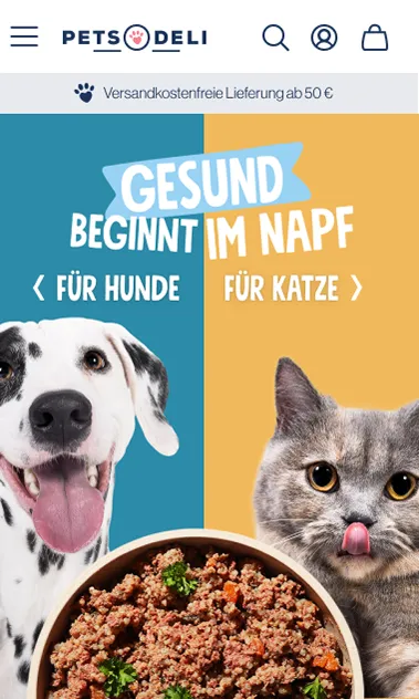 Homepage hero showing 'Gesund beginnt im Napf' tagline with a golden retriever, premium food bowls, and brand-consistent warm photography